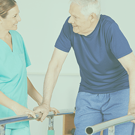 caregiver helps senior do the exercises